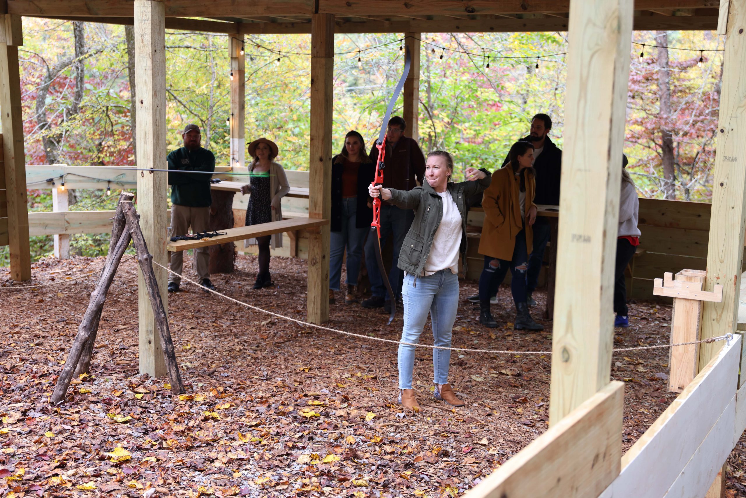 Enjoying archery in the natural beauty of the wooded hillside at Ancient Lore Village